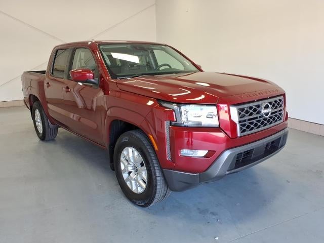 2023 Nissan Frontier SV in Red — front three-quarter view
